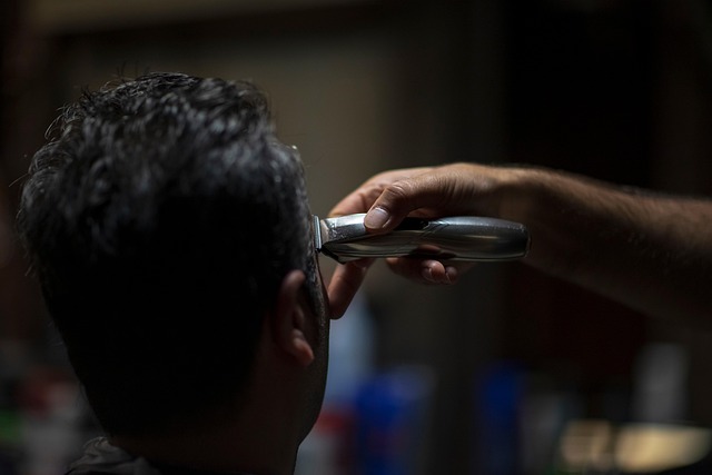 barber instructor demonstrating technique students watching